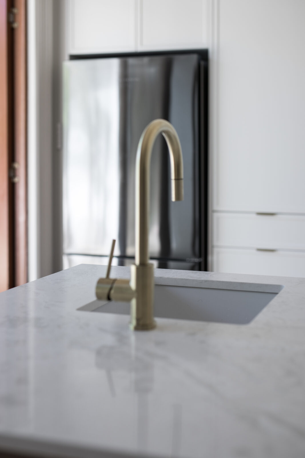 Undermount sink and mixer tap on marble kitchen benchtop