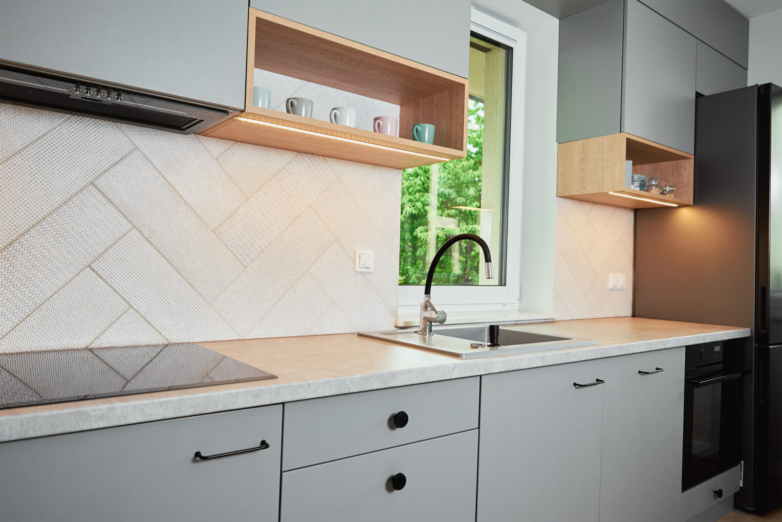 Grey shaker kitchen cabinets with undermount sink